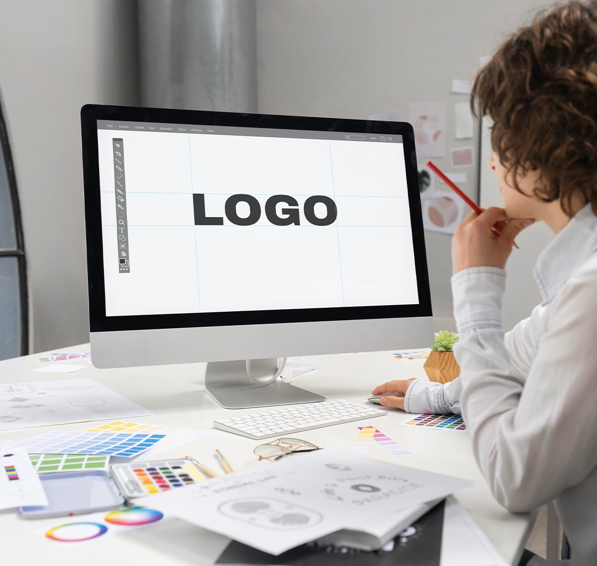 logo designer working computer desktop